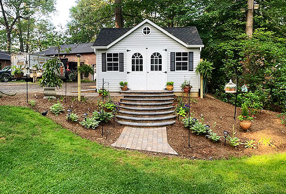 Image of lushoius green grass fresh mulch maintained by JMC Landscaping