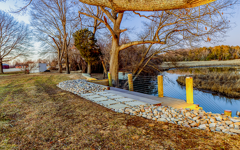 Image of a stepping stone pathway surrounded by a bed of river rock.